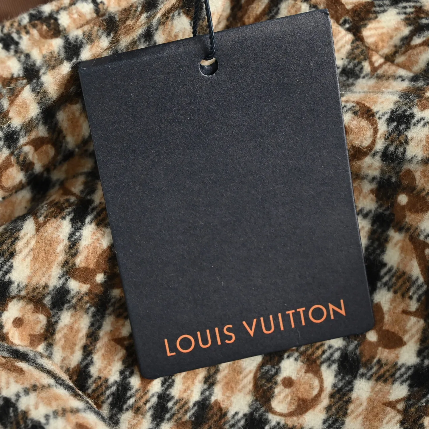 Louis Vuitton jacket with embroidered badges and all-over monogram print.